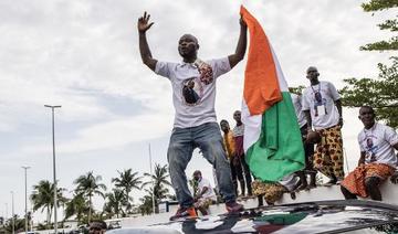 Tout au long du parcours, des milliers de jeunes pro-Gbagbo enthousiastes couraient, sautaient en criant «Gbagbo est là», «Gbagbo revient» (Photo, AFP)
