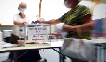 Une électrice vote à Saint-Rémy-Sur-Avre, dans le nord-ouest de la France, pour le premier tour des élections régionales françaises le 20 juin 2021 (Photo, AFP)