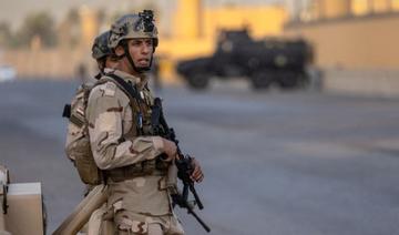 Des soldats de l'armée irakienne montent la garde sur une route entre l'ambassade des États-Unis et la zone internationale le 30 mai 2021 à Bagdad, en Irak (Photo, AFP)