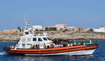 Des migrants de Tunisie et de Libye arrivent à bord d'un bateau italien de la Guardia Costiera (garde-côtes) sur l'île italienne de Lampedusa, le 1er août (Photo, AFP)