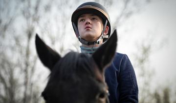 A Pékin, le cheval comme thérapie pour enfants autistes 