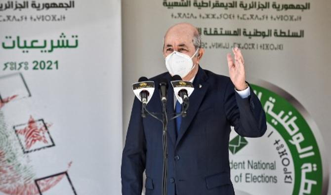 Le président algérien Abdelmadjid Tebboune s'exprime devant un bureau de vote à Bouchaoui, le 12 juin 2021 lors des élections législatives de 2021 (Photo, AFP)
