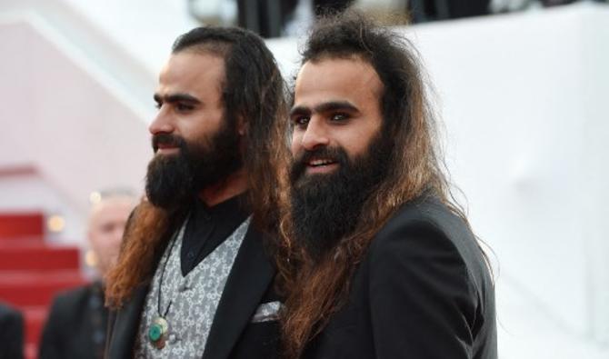 Cinéastes anticonformistes au look de guitaristes métal, les jumeaux Arab et Tarzan Nasser (Photo, AFP) 