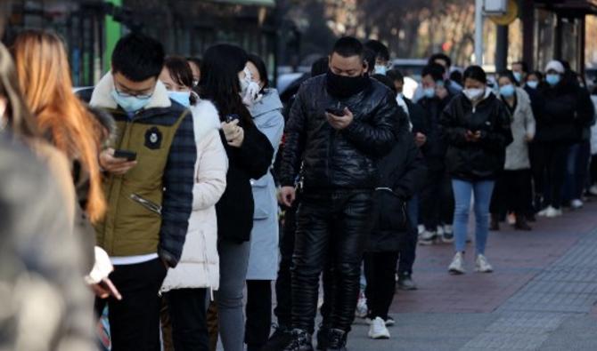 Des personnes faisant la queue pour être testées, dans la province du Shaanxi, au nord de la Chine, le 21 décembre 2021. (Photo, AFP)