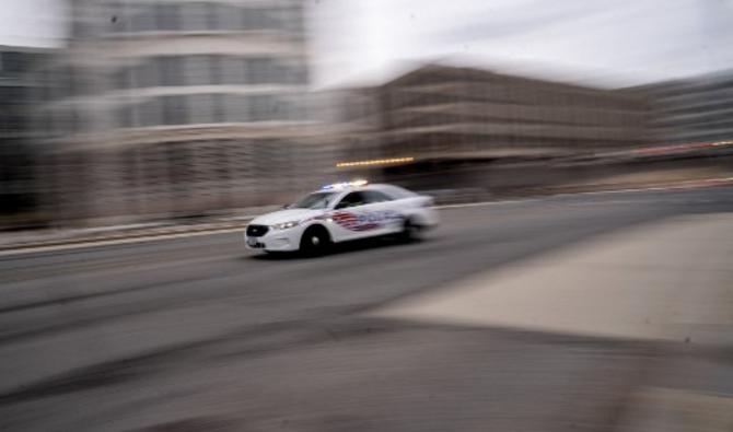 Une voiture de police traverse Washington, DC, le 25 janvier 2022. (Photo, AFP)