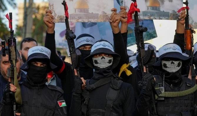Des militants des Brigades al-Qassam, la branche militaire du Hamas, lors d’un événement célébrant le 35e anniversaire de la fondation de l’organisation, dans la ville de Gaza, samedi 10 décembre 2022. (Photo AP)