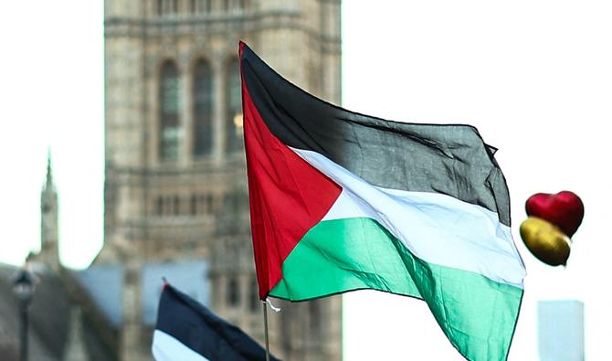 Un drapeau palestinien est photographié lors d'une marche nationale pour la Palestine dans le centre de Londres le 9 décembre 2023, appelant à un cessez-le-feu total dans la guerre à Gaza (Photo de HENRY NICHOLLS / AFP).
